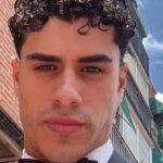 Alessandro Roncaccia nel ritratto ufficiale del Grande Fratello VIP 9